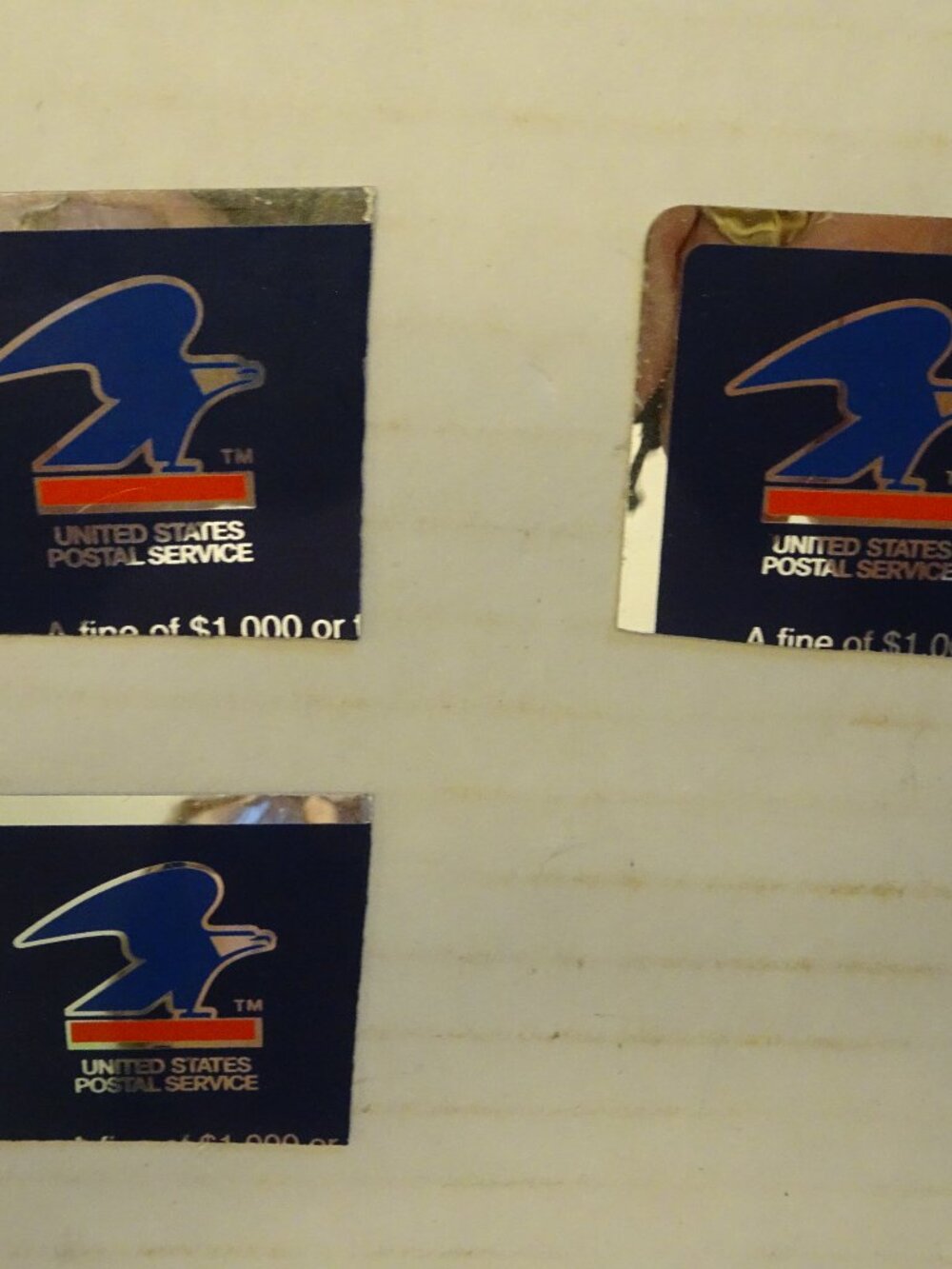 USPS - $1,000 Fine Sticker for mail receptacle - 1 1/2 x 1 1/2 inches (Partial)